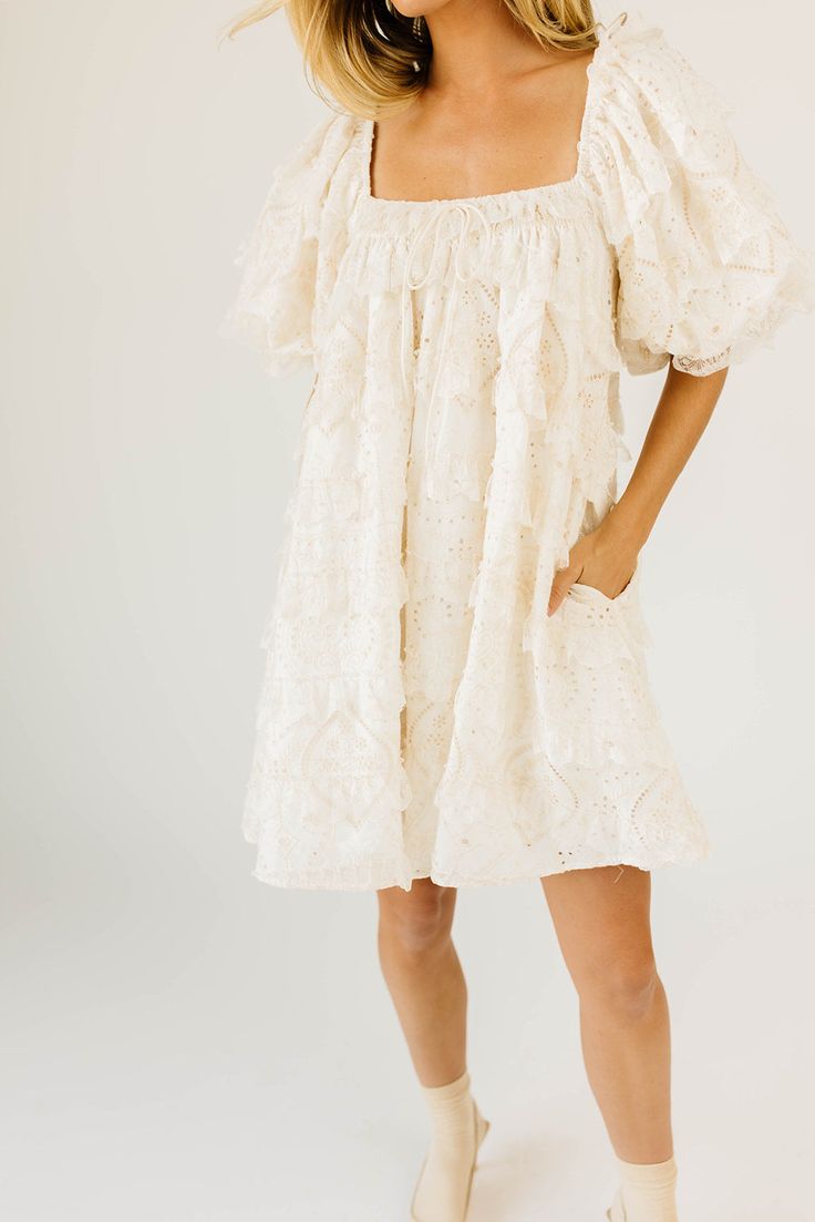 have your main character moment with this dreamy ivory puff sleeve mini dress. featuring dainty lace trim details + an elegant square neckline, this dress has heirloom-quality energy. from bridal showers to dinner dates, it’s guaranteed to be your new go-to. off white // mini length, scoop neckline, elastic neckline, lined, front bow detail, pockets, elastic cuffs model is 5'8" + wearing a small measurements are approximate + taken while laying flat xsmall : bust 32” length 31.5” small : bust 34 Main Character Moment, Holy Matrimony, Dinner Dates, Puff Sleeve Mini Dress, Date Dinner, Main Character, Square Necklines, Trim Detail, Bridal Showers