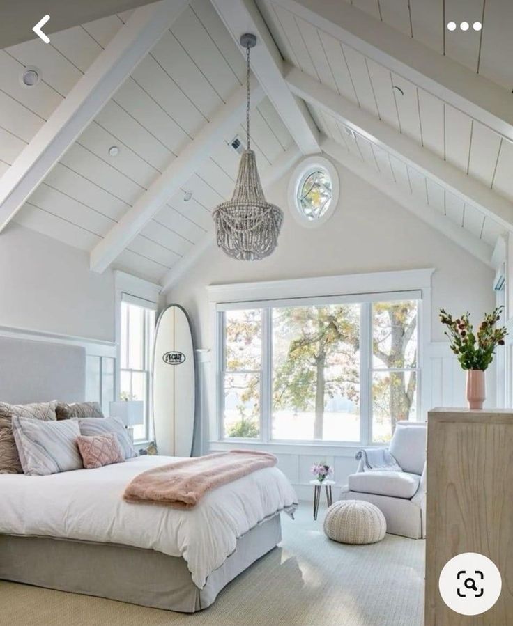 a large bedroom with white walls and ceilings