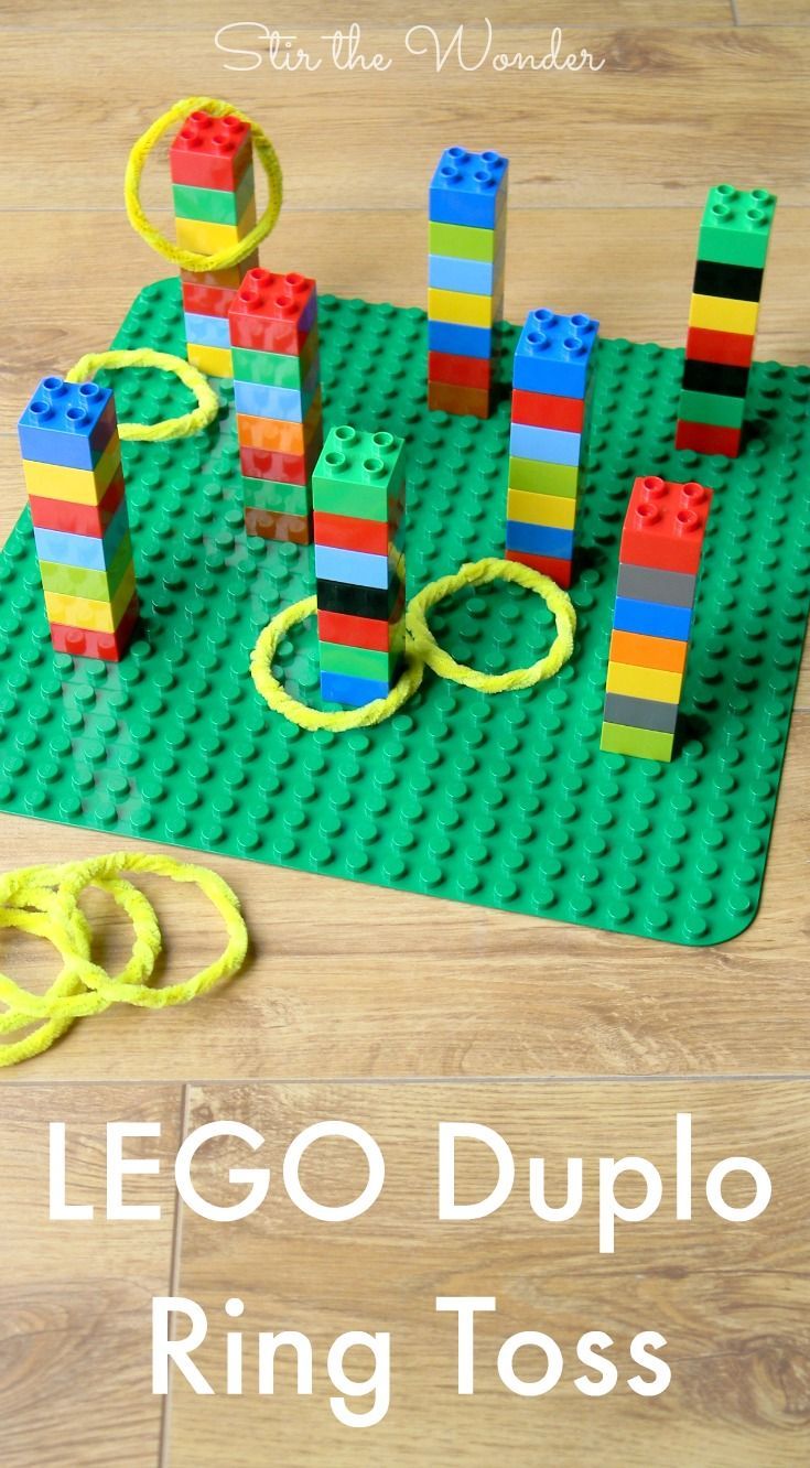 lego duplo ring toss game on the floor next to scissors and rubber bands