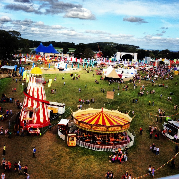 an aerial view of a fairground with carnival rides