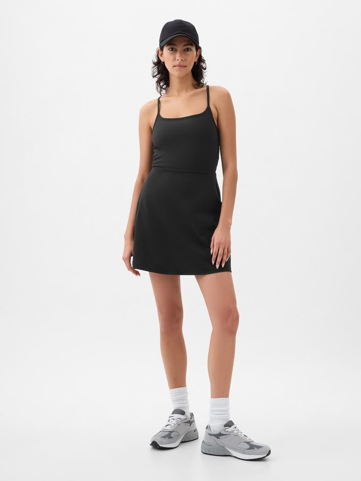 Soft brushed jersey exercise dress.  Moisture Wicking helps keep your skin dry.  Stretch allows freedom of movement while providing superior shape retention.  Square neck.  Adjustable spaghetti straps.  Built-in shorts.  This exercise dress is made with 79% recycled polyester.  Using recycled materials helps to conserve resources and reduce waste.  This product was made in a factory that invests in gender equality and women’s empowerment.  Through RISE Reimagining Industry to Support Equality) a Workout Dress Outfit, Athletic Dress Outfit, Exercise Fits, Black Tennis Dress, Capsule Style, Exercise Dress, Active Dress, Athleisure Dress, Athletic Dress