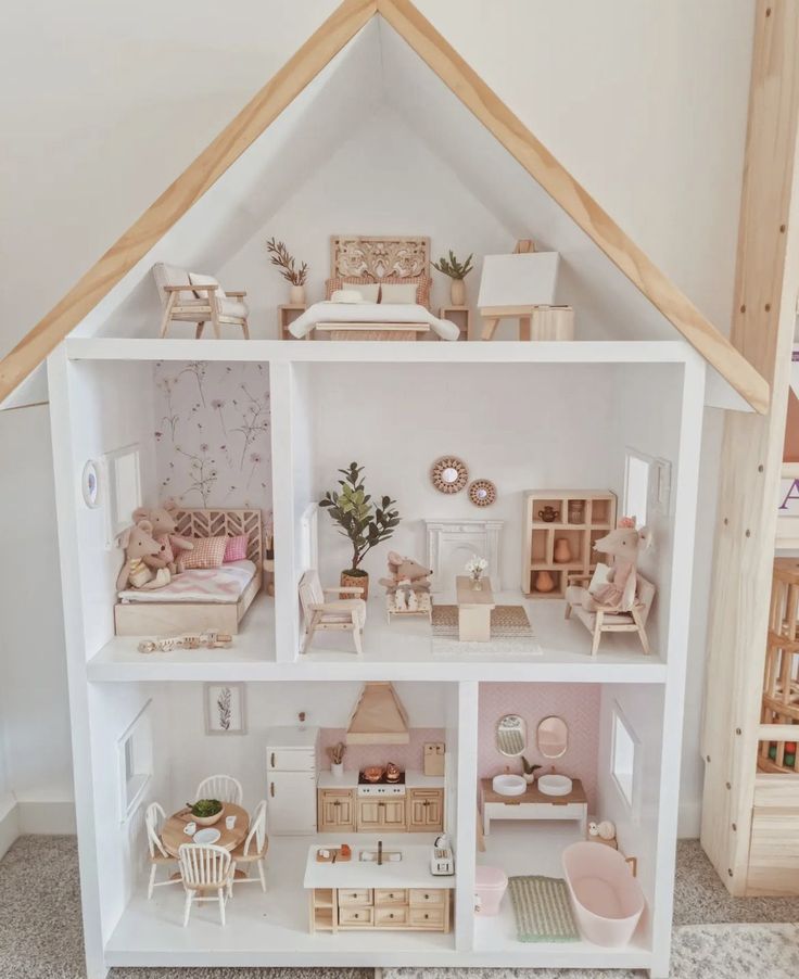 a doll house with all the furniture and accessories in it's white display case