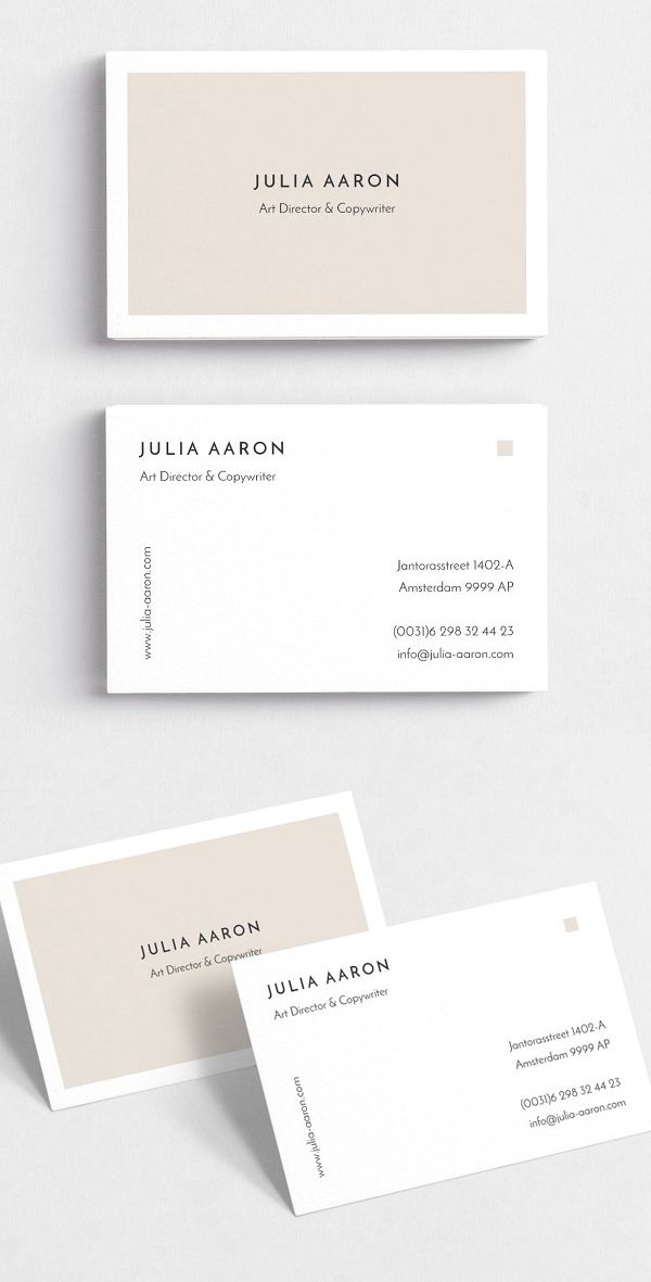 two white business cards with the same logo on them, one in grey and one in beige