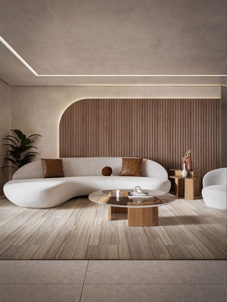 a modern living room with white couches and wood accents on the walls, along with a round coffee table