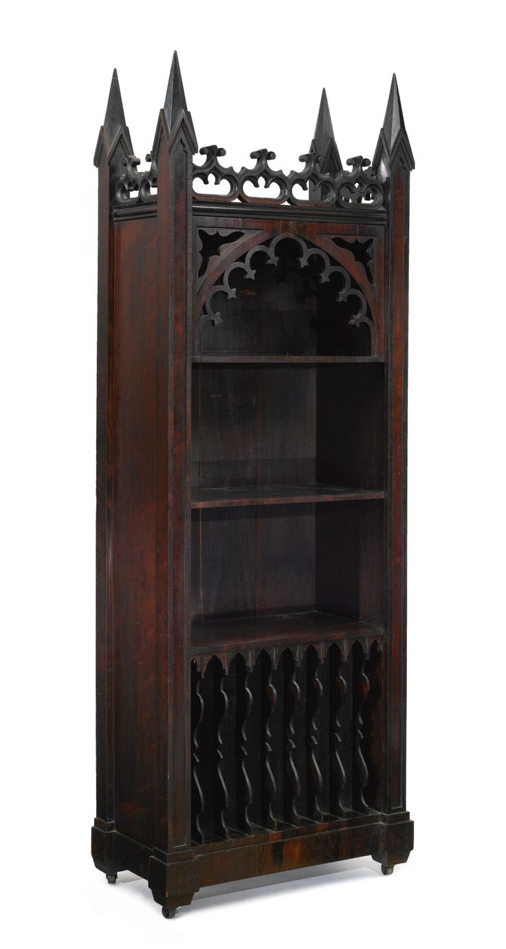 an old wooden bookcase with ornate carvings on the top and bottom shelf, against a white background