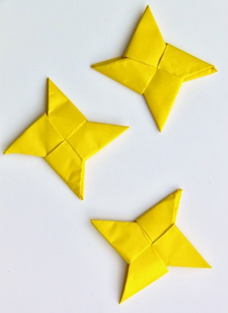 three yellow origami birds sitting next to each other