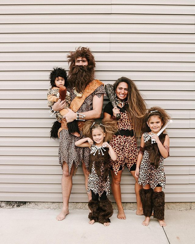 a group of people in costumes standing next to each other