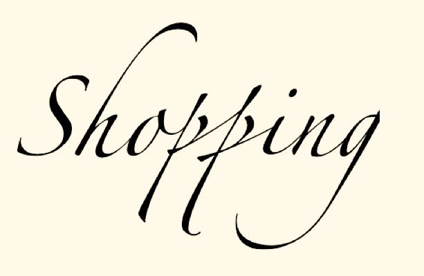 the word shopping written in cursive writing