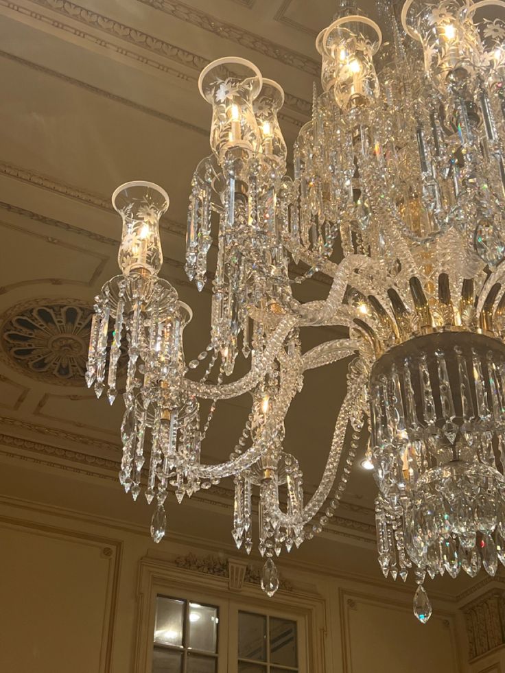 a chandelier hanging from the ceiling in a room