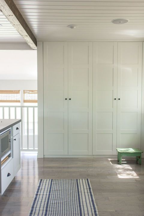 an image of a room with white cupboards