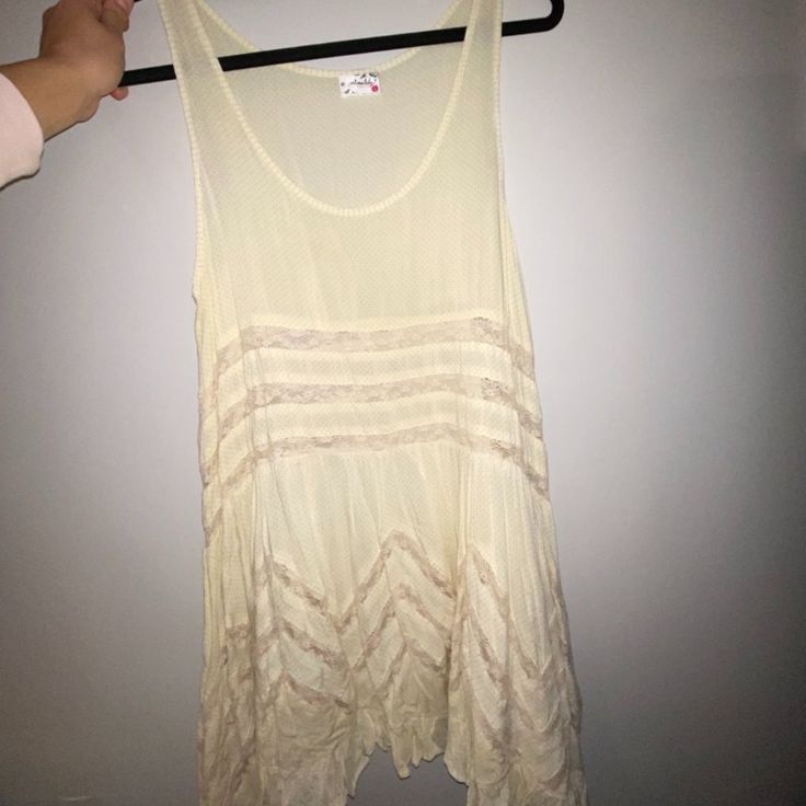 Never Worn Flowy Long Tunic Tank Top. Can Be Worn As A Dress. Size Medium And Large Available. Sleeveless Cotton Mini Dress For Beach Cover-up, Sleeveless Beach Dress With Ruffles, Flowy Sleeveless Beach Dress With Ruffles, Daytime Sleeveless Mini Dress With Lace Trim, Beige Sleeveless Sundress With Lace Trim, Sleeveless Beige Mini Dress For Daytime, Beige Sleeveless Mini Dress For Daytime, Summer Mini Dress With Lace Trim As Beach Cover-up, Cream Sleeveless Sundress