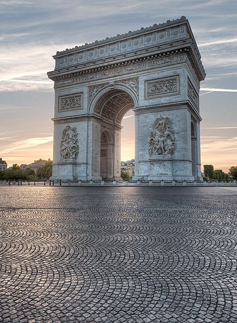 an image of the arc de trioe in paris, france at sunset or dawn