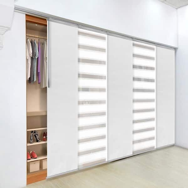 an open closet with sliding doors and shoes