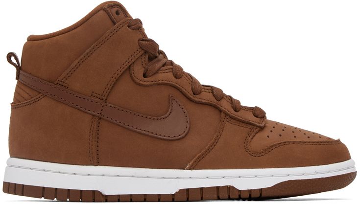 the nike dunk high top sneaker is made from brown sued and features white outs