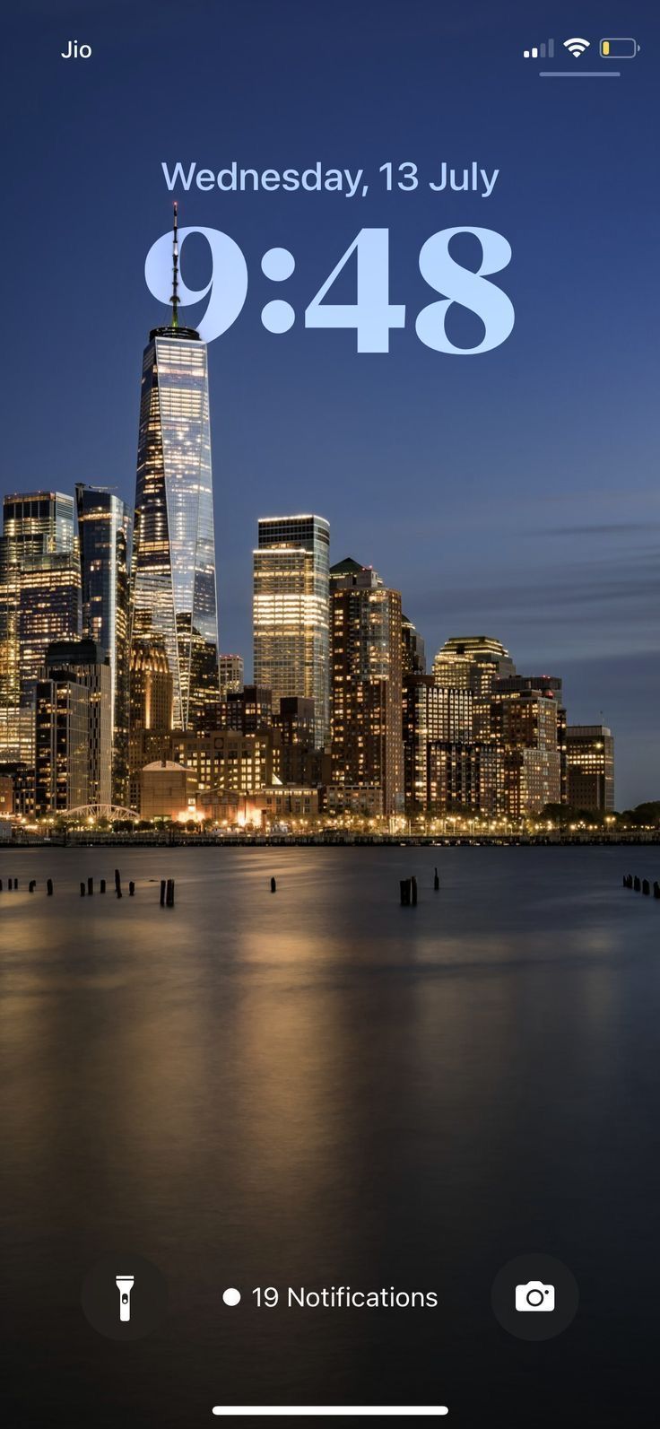 the new york city skyline is lit up at night, and it's time to go