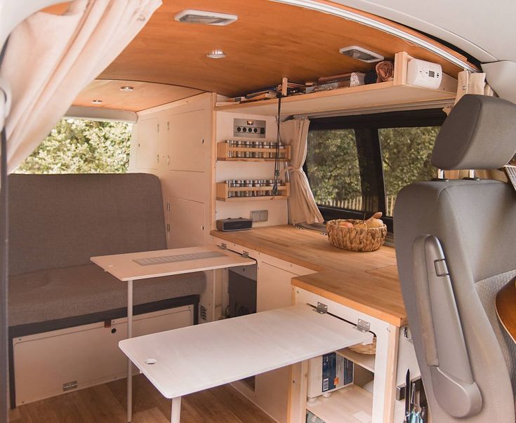 an interior view of a camper with wood flooring