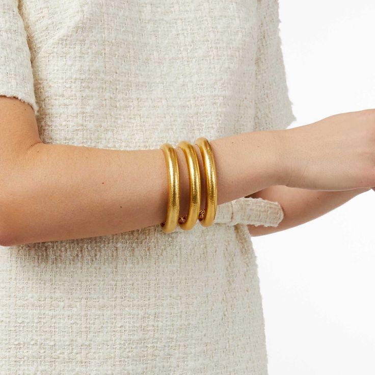 Elegant yet simple, this statement-making golden bangle features a lightly hand-hammered finish. An ornately geometric piercework interior adds lightness and luxury for wearing stacked or solo. Home / New Arrivals / Havana Statement Bangle Havana Statement Bangle Regular price $130 Regular price Size Buy now with ShopPayBuy with Description Details 24K gold plate Inner circumference: 7.8 inches (small), 8.1 inches (medium), 8.5 inches (large) Width: 0.4 inches Julie Vos hallmark Julie Vos jewelr Golden Bangles, Active Wear Dresses, Arm Accessories, Julie Vos, Stackable Bangles, Cashmere Accessories, Gold Plated Bangles, Stacked Bangles, Holiday Items