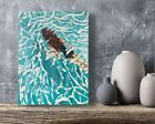 an abstract painting of a man swimming in the ocean on a wooden shelf next to eggs