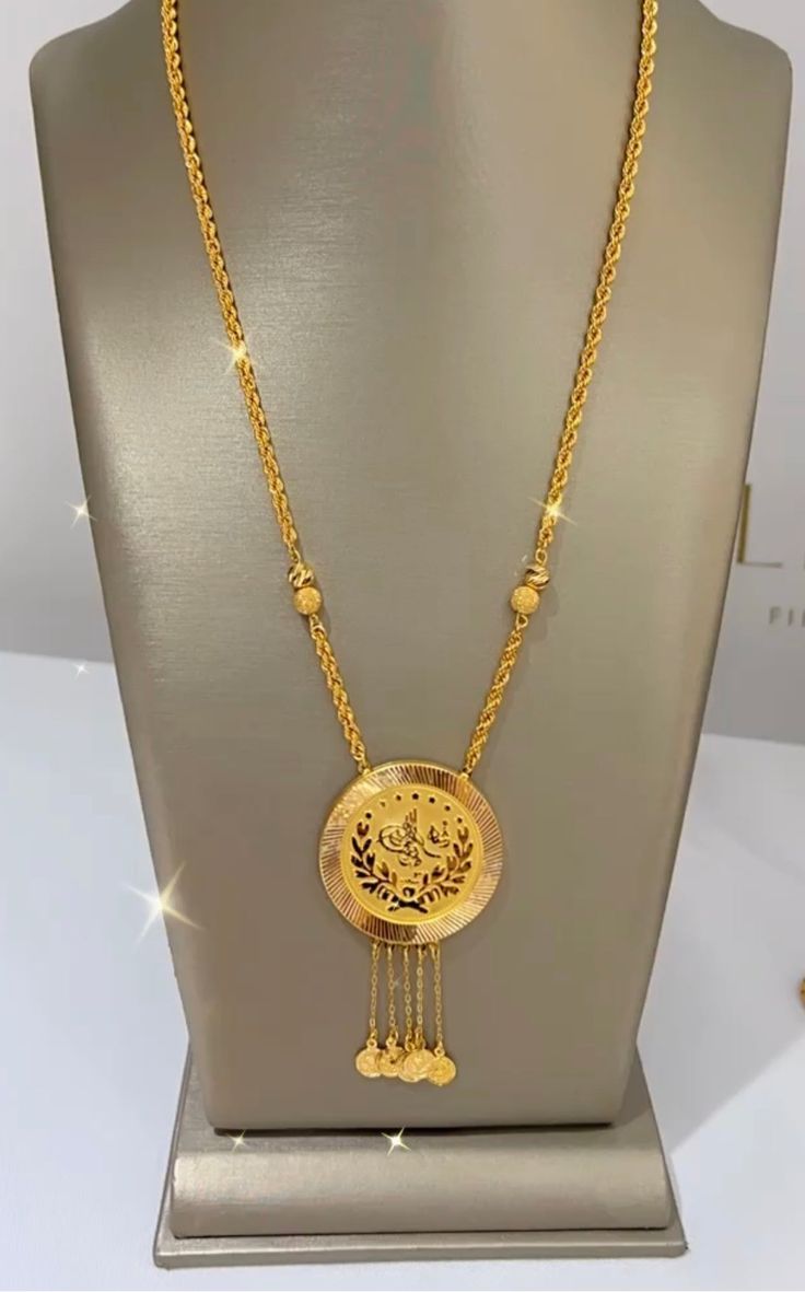 A Turkish coin necklace on 21k gold is a captivating piece of jewelry that combines historical and cultural elements with the luxury of high-purity gold. This necklace typically features an authentic Turkish coin, often an Ottoman or ancient coin, set in a 21k gold bezel or frame. The gold used is 21 karats, which means it's a high-quality and beautifully rich yellow gold. 19.10 grams length 22'' These necklaces are not only a fashion statement but also a nod to Turkish heritage and history. The Cheap Gold Amulet Jewelry, Luxury Antique Gold Pendant Necklace, Arab Gold Coin Jewelry, Turkish Pendant Jewelry, Gold Pendant Jewelry Turkish, Luxury 22k Gold Byzantine Jewelry, 22k Gold Necklace Pendant, Jewelry Gold Turkish, Luxury 22k Gold Necklaces