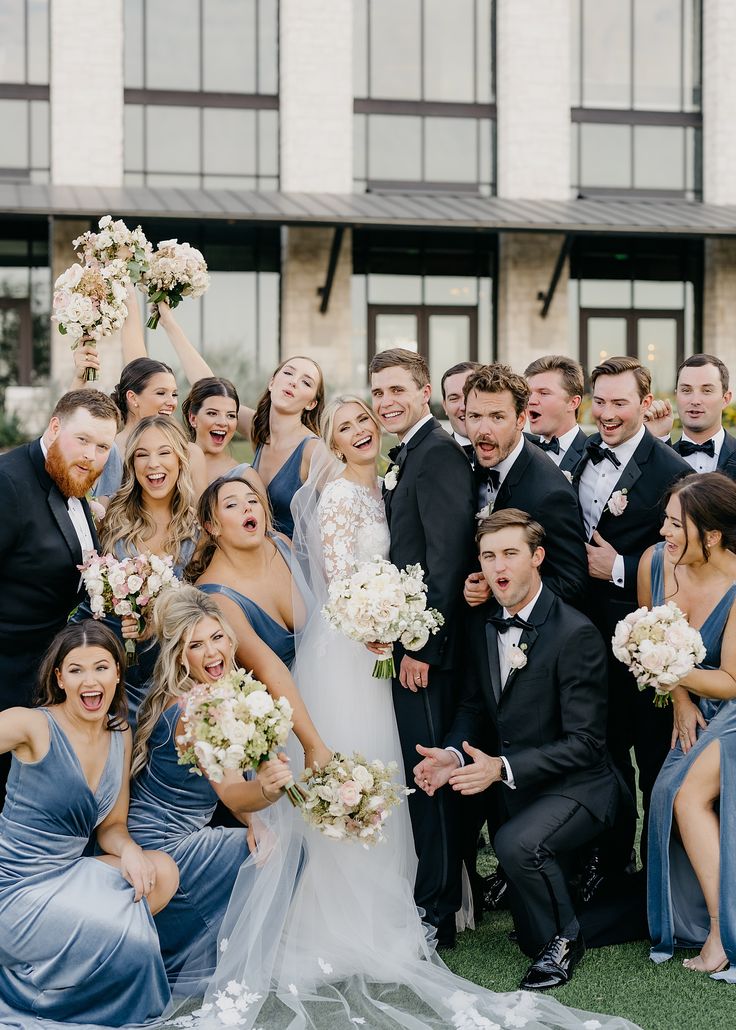 fun wedding party on wedding day at Omni Barton Creek Blue Tux Bridal Party, Blue Wedding Photography, Steel Blue And Black Wedding, Dusty Blue Black And Gold Wedding, Light Blue Velvet Bridesmaid Dresses, Blue Bridesmaid And Black Groomsmen, Black Suits Blue Dresses Wedding, Dusty Blue Bridesmaid Dresses And Black Suits, Black Blue Grey Wedding Color Schemes