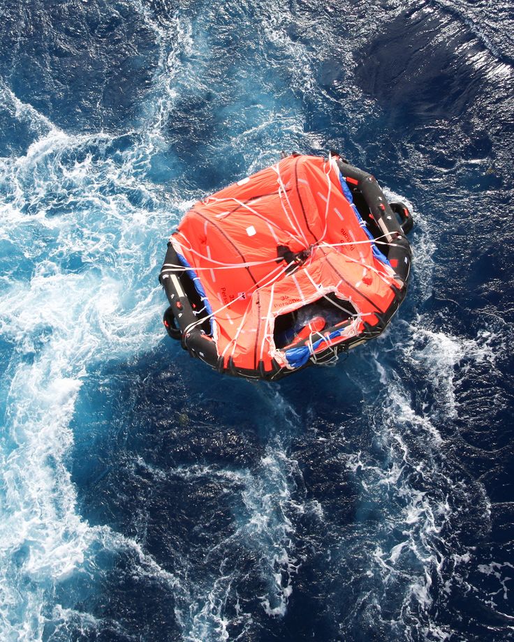 an inflatable raft floating on top of the ocean