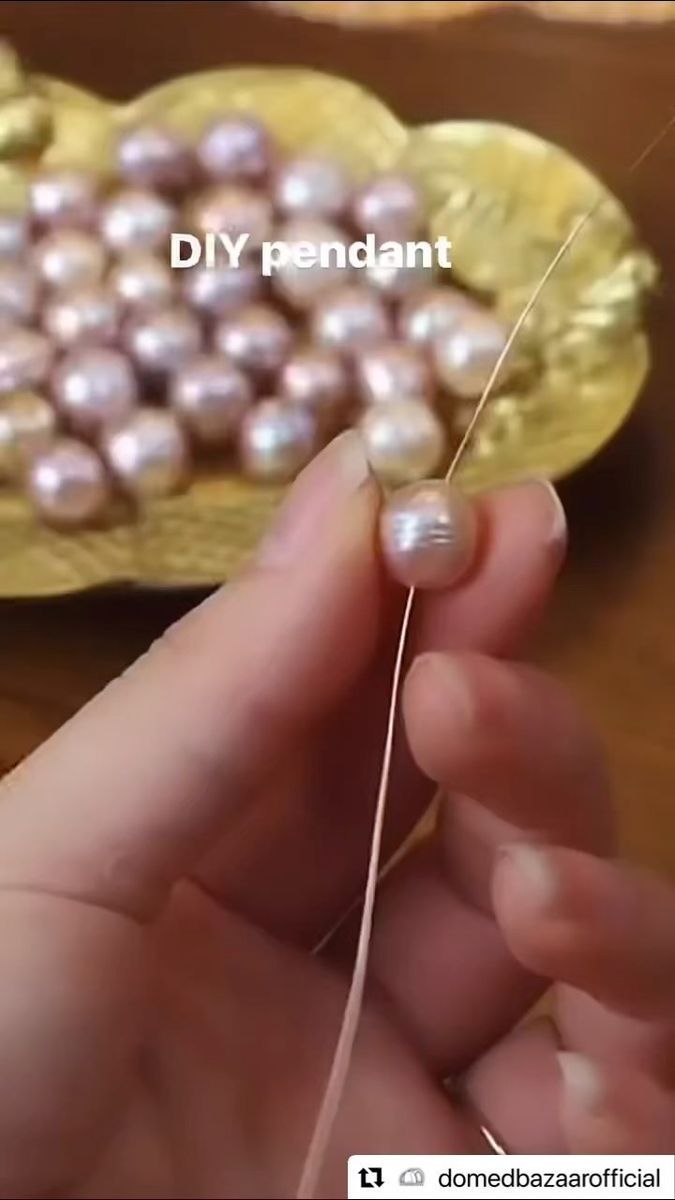 someone is threading pearls onto a yellow plate with the words diy pendant on it