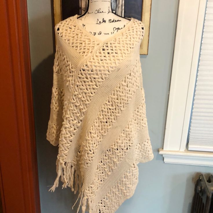 By Riah Fashion. Os. Bnwt. Cream-Colored Open Knit/Crochet Poncho With Textured Detail And Tasseled Fringe. Absolutely Gorgeous!! Beige Knit Poncho One Size, Beige Knit Poncho, Beige Knit Poncho For Spring, Spring Beige Knit Poncho, One-size Beige Knit Poncho, Bohemian Open Knit Poncho One Size, One Size Bohemian Open Knit Poncho, White Knitted One-size Poncho, Open Knit Poncho For Beach