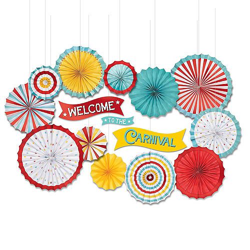 an assortment of colorful paper fan decorations hanging from strings with the words welcome to the carnival