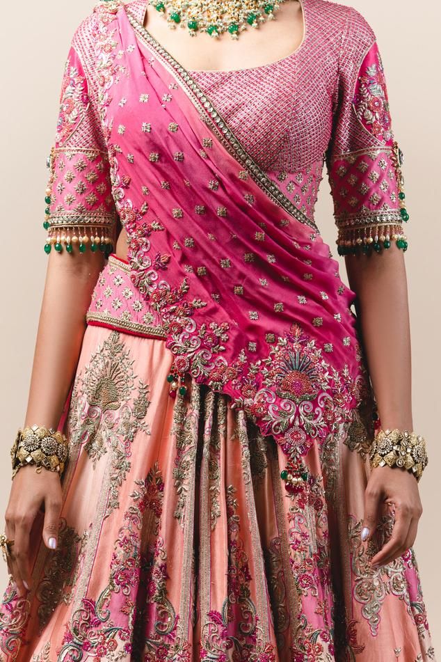 Blush silk dupion lehenga with flat zari worked motifs. Paired with resham and zari grid embroidered blouse and tassel dupatta.
Component: 3
Embroidered
Neckline: U Neck
Sleeve Length: Half
Fabric: Lehenga: Silk Dupion; Dupatta: Handloom; Blouse: Net
Color: Pink
Cutout back
Bead tassels
Cutwork detail - Aza Fashions Transitional Tissue Silk Lehenga With Traditional Drape, Transitional Traditional Drape Tissue Silk Lehenga, Silk Traditional Wear With Cutdana Detailing For Reception, Silk Traditional Wear With Cutdana For Reception, Pink Art Silk Pre-draped Saree With Intricate Embroidery, Silk Anarkali Set With Pallu For Reception, Transitional Banarasi Silk Pre-draped Saree For Reception, Transitional Pre-draped Banarasi Silk Saree For Reception, Banarasi Silk Saree Set For Reception