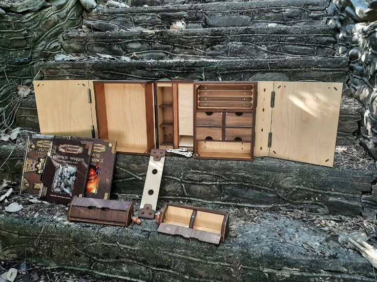 an assortment of wooden boxes sitting on the ground