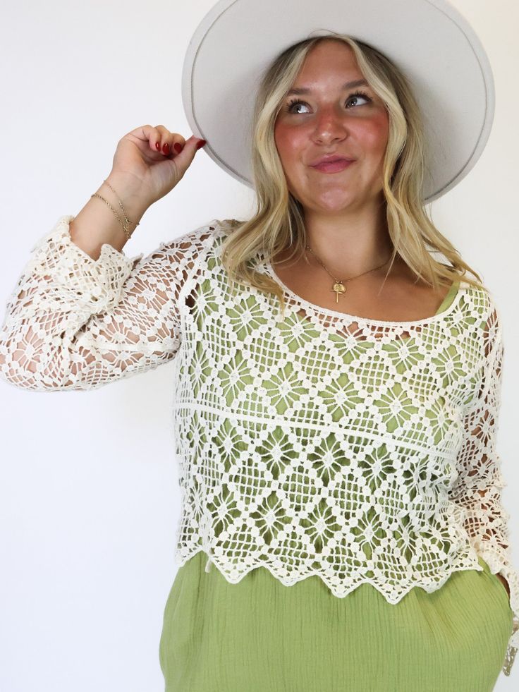 With a delicate crochet design and a flattering U-neck, it's a timeless piece for any occasion. It is perfect for partnering with a colored tank underneath, adding dimension to any look. Embrace effortless charm with this versatile wardrobe staple that can also double as a swimsuit coverup top. Fitted Pointelle Knit Lace Top For Spring, Spring Vacation Lace Top With Crochet Trim, Bohemian Cotton Lace Top For Spring, Spring Fitted Knit Top With Lace Trim, Summer Lace Top For Layering, Chic Summer Cotton Lace Top, Feminine Fitted Crochet Top With Pointelle Knit, Spring Crochet Top For Day Out, Spring Fitted Crochet Top For Day Out