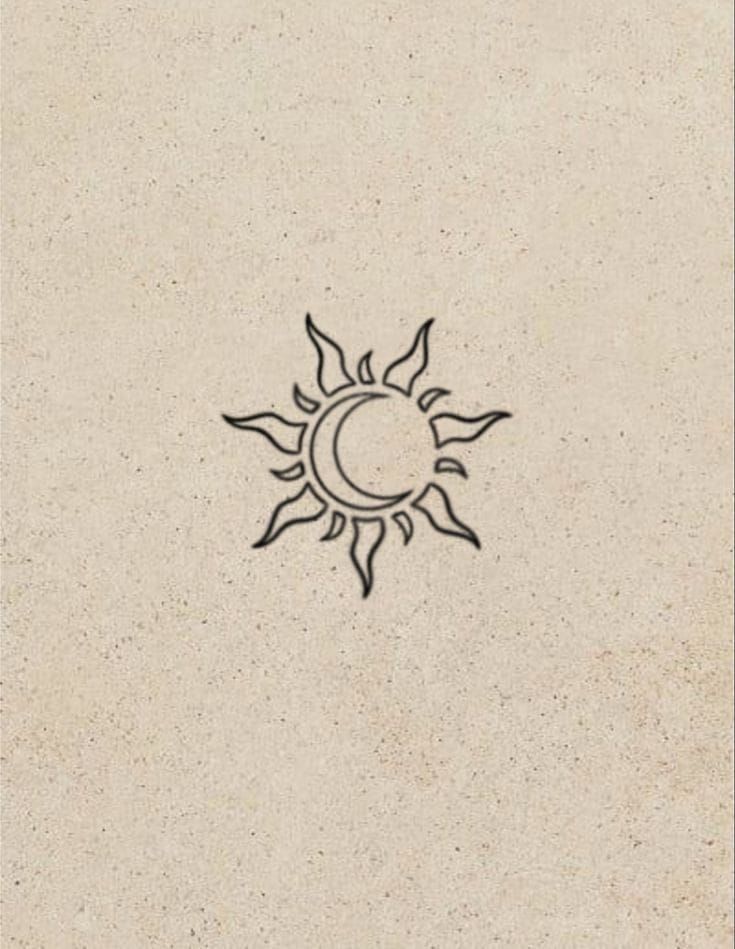 the sun and moon are drawn in black ink on a beige paper background, which is very similar to each other