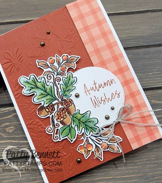 a close up of a card on a wooden surface with the words autumn wishes printed on it