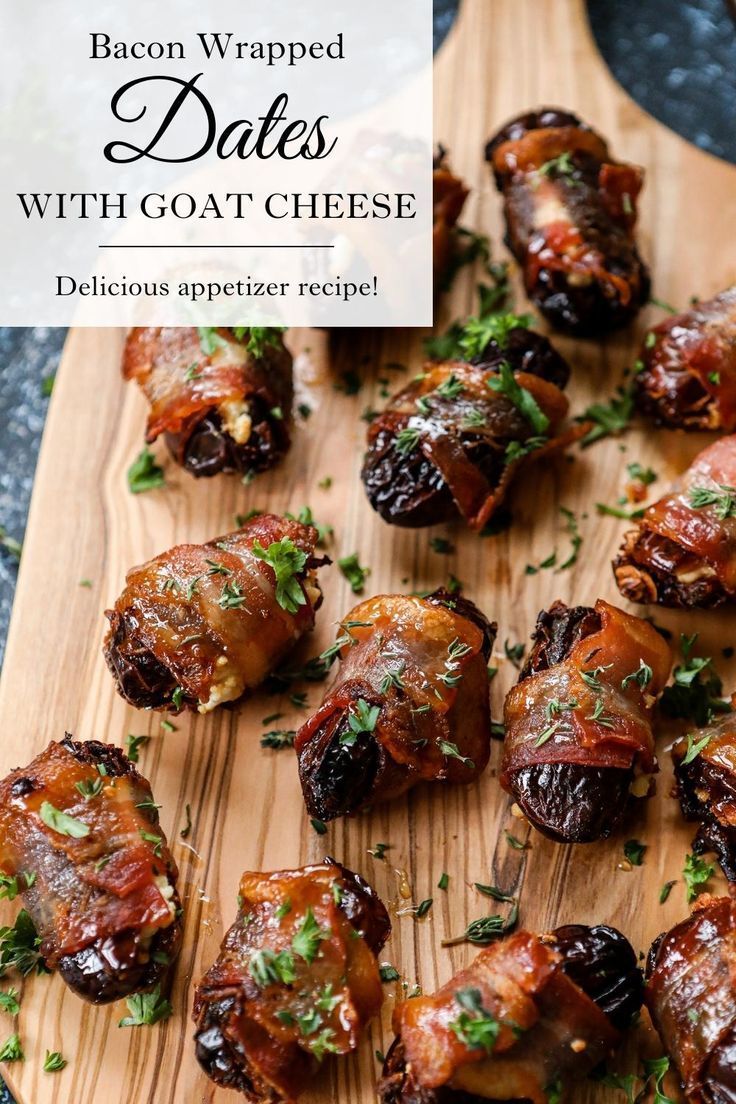 bacon wrapped dates with goat cheese on a cutting board