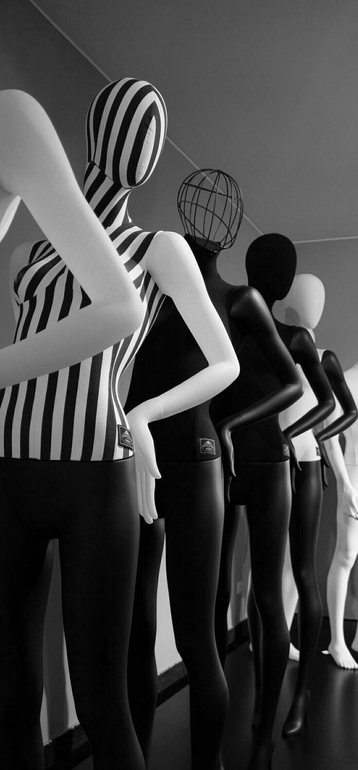 mannequins are lined up in black and white