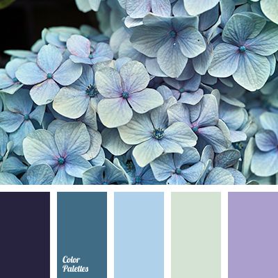 the color scheme is blue and purple with white flowers on it, as well as green leaves