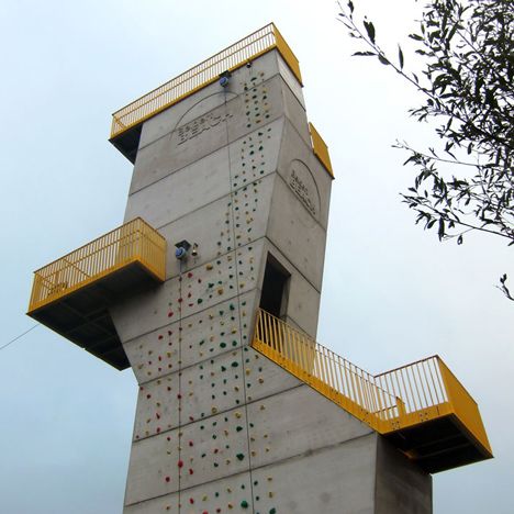 the climbing wall is built into the side of the building