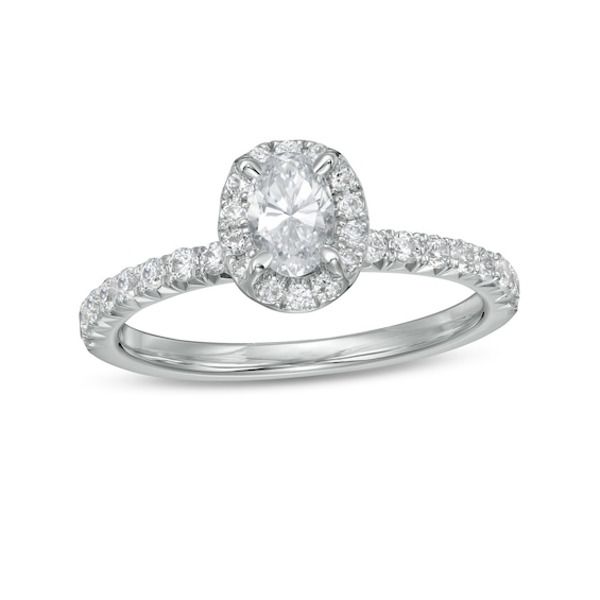 She'll love the classic look of this stunning diamond engagement ring. Created in 14K white gold, this choice showcases a 1/2 ct. oval-shaped diamond wrapped in a diamond halo. Underneath, diamonds glisten along the setting and shank. Radiant with 1 ct. t.w. of diamonds and a brilliant buffed luster, this engagement ring complements her unique style - today and always. Timeless Oval Diamond Anniversary Ring, Oval Diamond White Diamond Ring For Anniversary, Oval Brilliant Cut Diamond Ring For Anniversary, Oval Diamond Ring With Brilliant Cut For Anniversary, Oval Brilliant Cut Diamond Anniversary Ring, Oval Diamond Halo Ring For Anniversary, Diamond White Oval Halo Ring With Brilliant Cut, Oval Brilliant Cut Diamond White Halo Ring, Oval Diamond Ring For Proposal