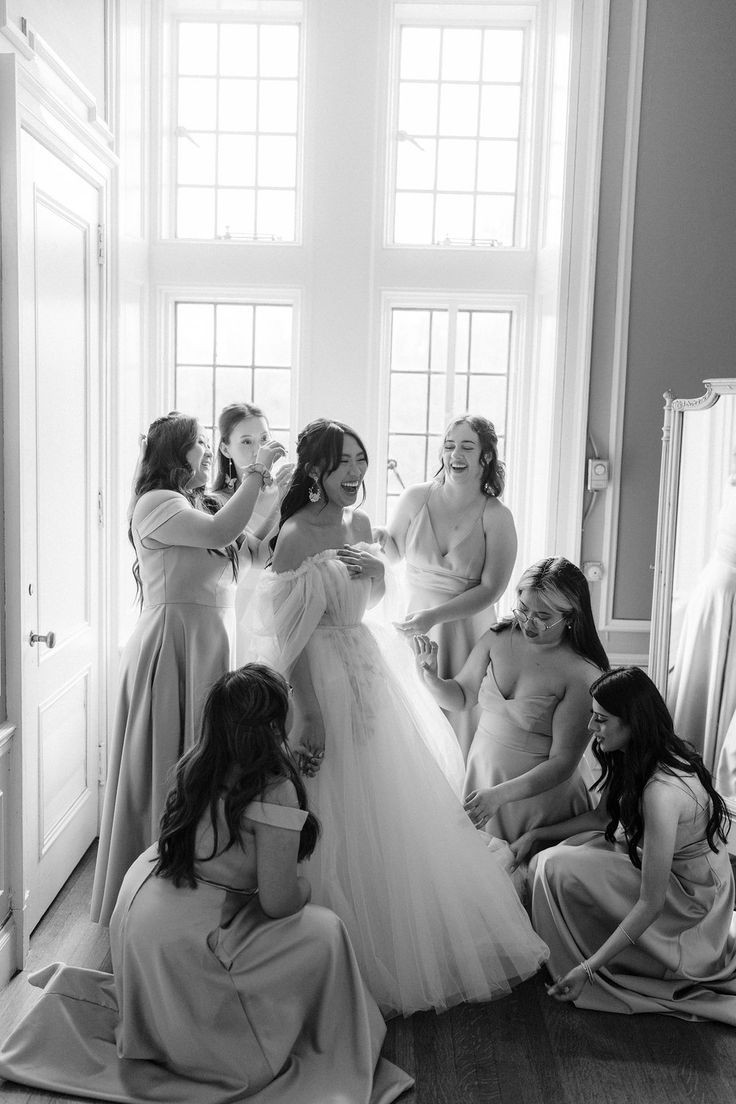 a group of women standing around each other