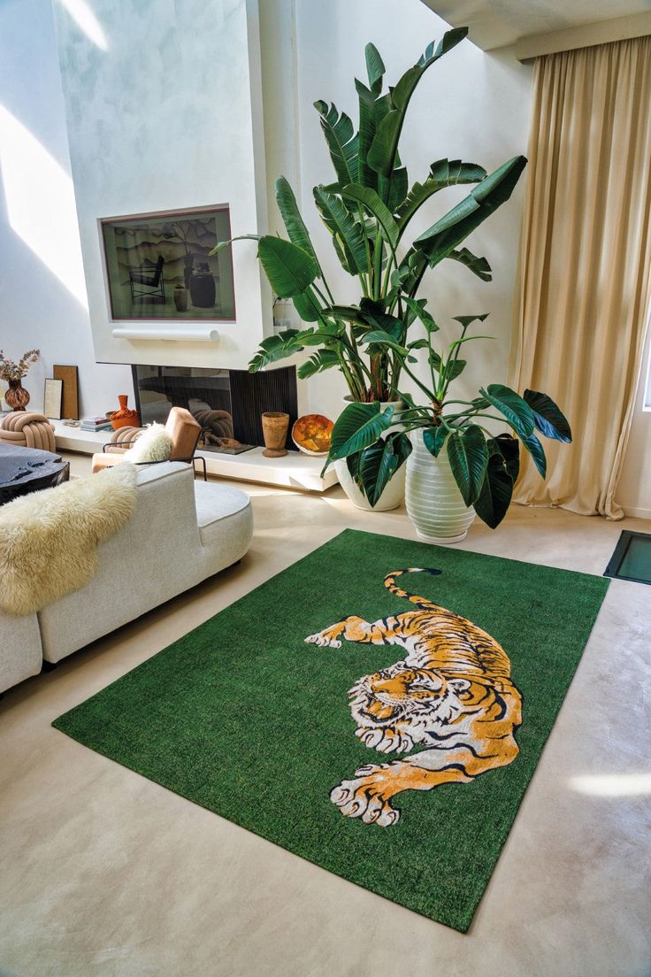 a living room filled with furniture and a large rug covered in a tiger design on the floor