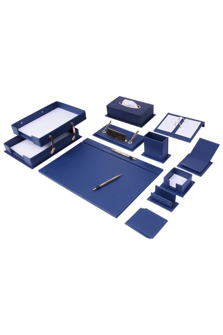 an assortment of office supplies including pens, notebooks and binders on a white background