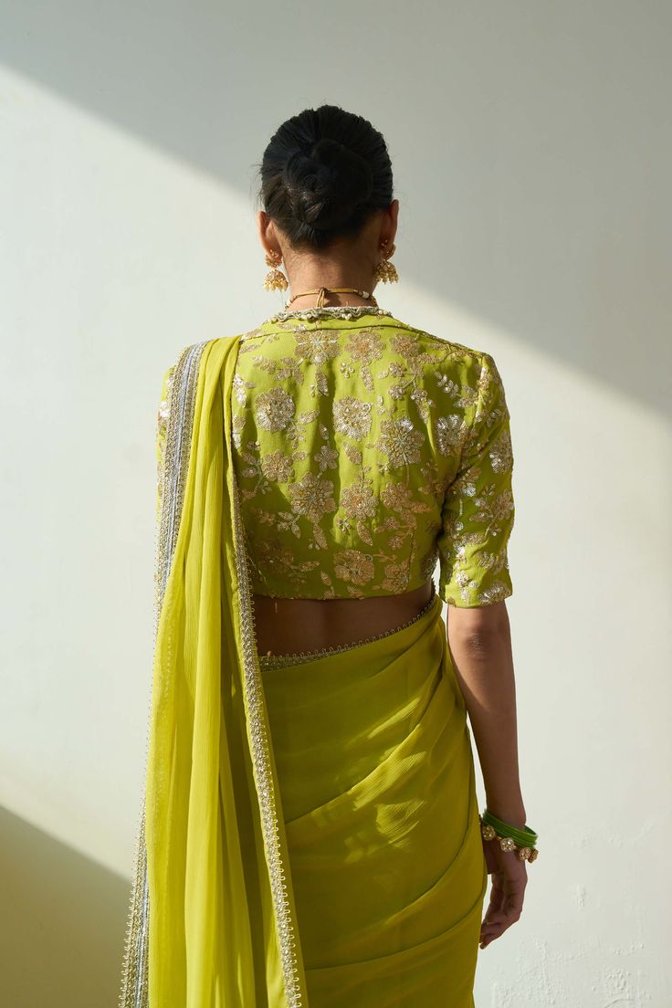 Introducing the mesmerizing soraya sari and blouse set, fashioned from luxurious georgette fabric in a captivating lime green hue. This ensemble comprises two stunning components, meticulously adorned with intricate embroidery including trims, cutwork, and delicate handwork. Elevate your allure with this ethereal ensemble, designed to captivate attention at any special occasion. Green Pre-draped Saree With Intricate Embroidery For Festivals, Green Chikankari Pre-draped Saree For Diwali, Green Chanderi Pre-draped Saree For Reception, Festive Pista Green Pre-draped Saree With Chikankari Embroidery, Green Georgette Choli With Cutdana, Green Chanderi Pre-draped Saree With Chikankari Embroidery, Green Silk Saree With Resham Embroidery, Designer Pista Green Pre-draped Saree With Cutdana, Designer Wear Pista Green Cutdana Pre-draped Saree