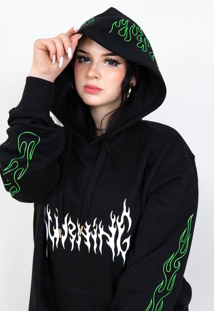 "Black hoodie with a white \"BURNING\" print on front and green flames on hood and sleeves. The model is 167 cm tall and wears size XL. JOIN US ON INSTAGRAM 🌹 http://instagram.com/blvck.pl 🏷 PRODUCT DETAILS 🏷 Hand-printed Unisex 80% High-quality Cotton 20% Polyester Made in Poland 📏 SIZING & FIT 📏 All our sweatshirts and T-shirts are unisex. Measurements (width/length) S - 54/67 cm (21\"/26\") M - 57/69 cm (22.5\"/27\") L - 60/71 cm (23.5\"/28\") XL - 63/73 cm (25\"/29\") XXL - 65/76 cm Y2k Streetwear Hoodie With Crew Neck, Y2k Crew Neck Hoodie For Streetwear, Y2k Streetwear Hoodie With Drawstring Hood, Grunge Hooded Top For Streetwear, Hooded Grunge Tops For Streetwear, Halloween Grunge Streetwear Hoodie, Edgy Streetwear Sweatshirt For Spring, Y2k Style Cotton Hoodie For Streetwear, Cotton Y2k Hoodie For Streetwear