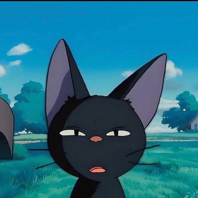 an animated black cat standing in the grass