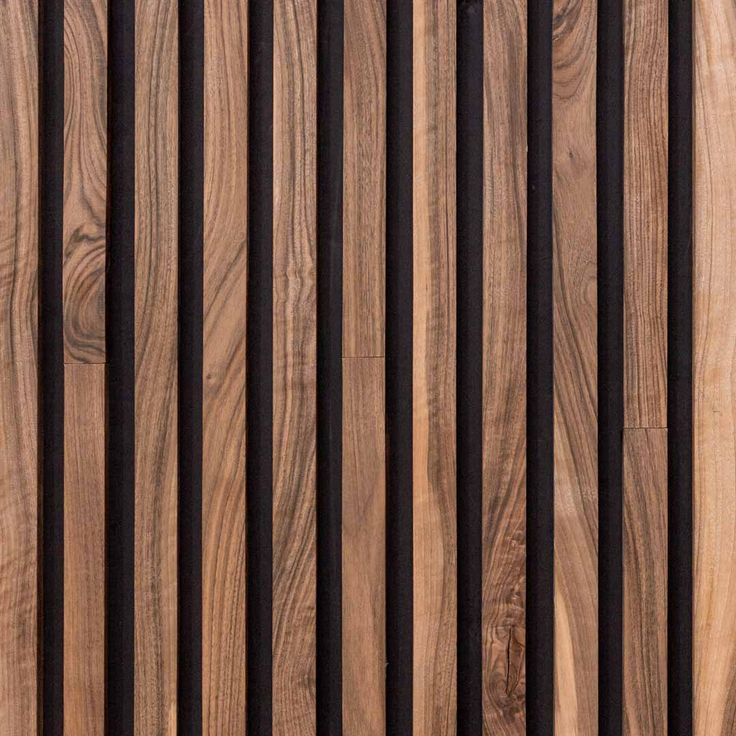 wood planks are lined up on the side of a wooden wall with black strips