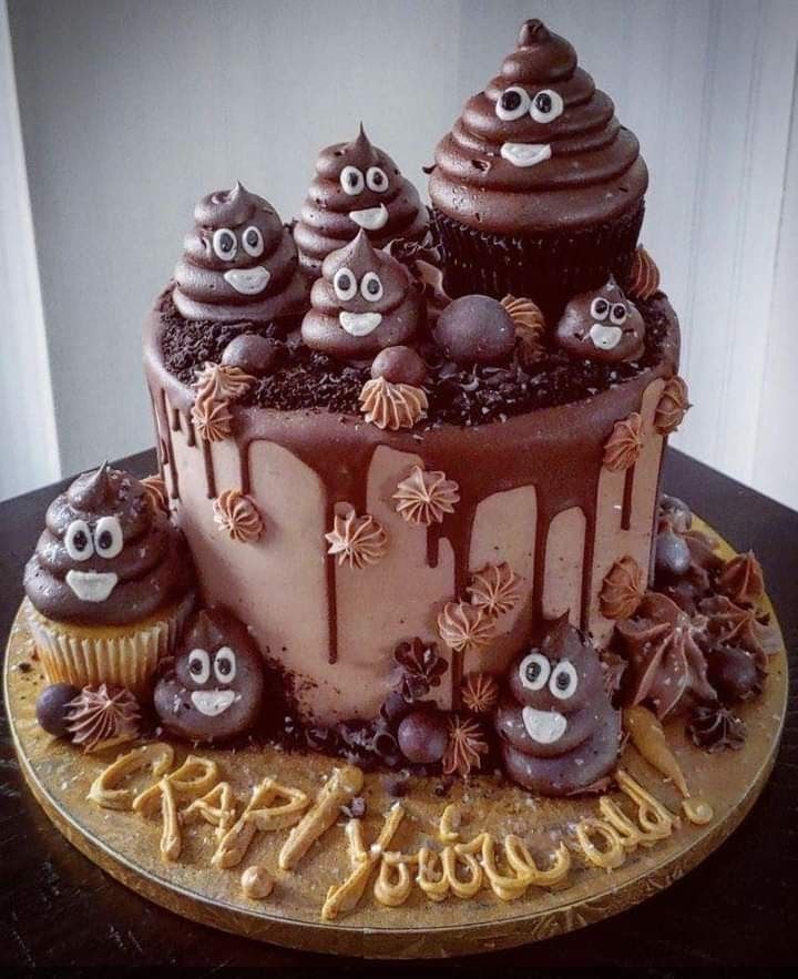 a chocolate birthday cake decorated with halloween decorations