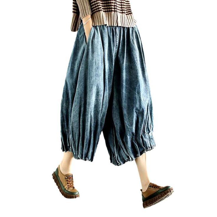 Rediscover the essence of y2k fashion with our pleated culottes denim pants from our 2023 Spring Collection! Crafted from luxe denim with a high-waisted silhouette. these vintage-inspired gaucho feature a unique folded design that adds a touch of sophisticated finesse. A zipper closure ensures comfort and effortless style. making these pants a must-have for the fashionista in you!Why This Piece Is a Wardrobe StapleStrike the perfect balance between retro and modern trend with these timeless culo Cotton Wide Leg Cropped Jeans For Fall, Fall Cotton Wide-leg Cropped Jeans, Wide-leg Cotton Cropped Jeans For Fall, Retro Baggy Wide-leg Bottoms, Retro Baggy Wide Leg Bottoms, Retro Baggy Medium Wash Bottoms, Oversized Wide Leg Denim Blue Bottoms, Relaxed Fit Cotton Wide-leg Culottes, Spring Washed Wide-leg Jeans