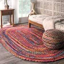 a living room with a couch and rug on the floor