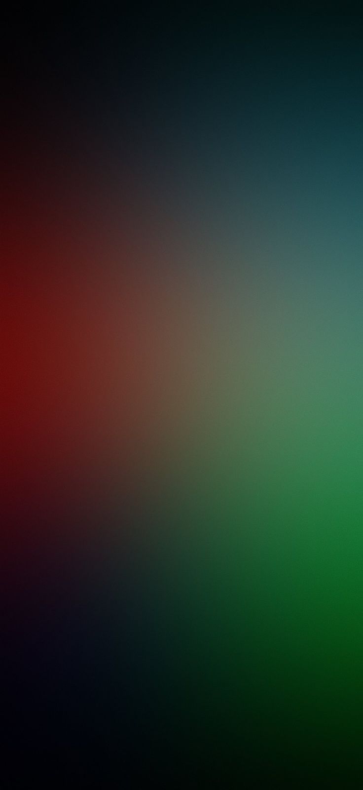 a blurry image of an orange, green and red background