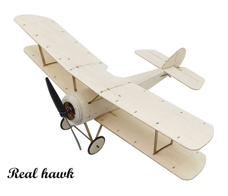 a wooden model of a single engine plane on a white background with clippings